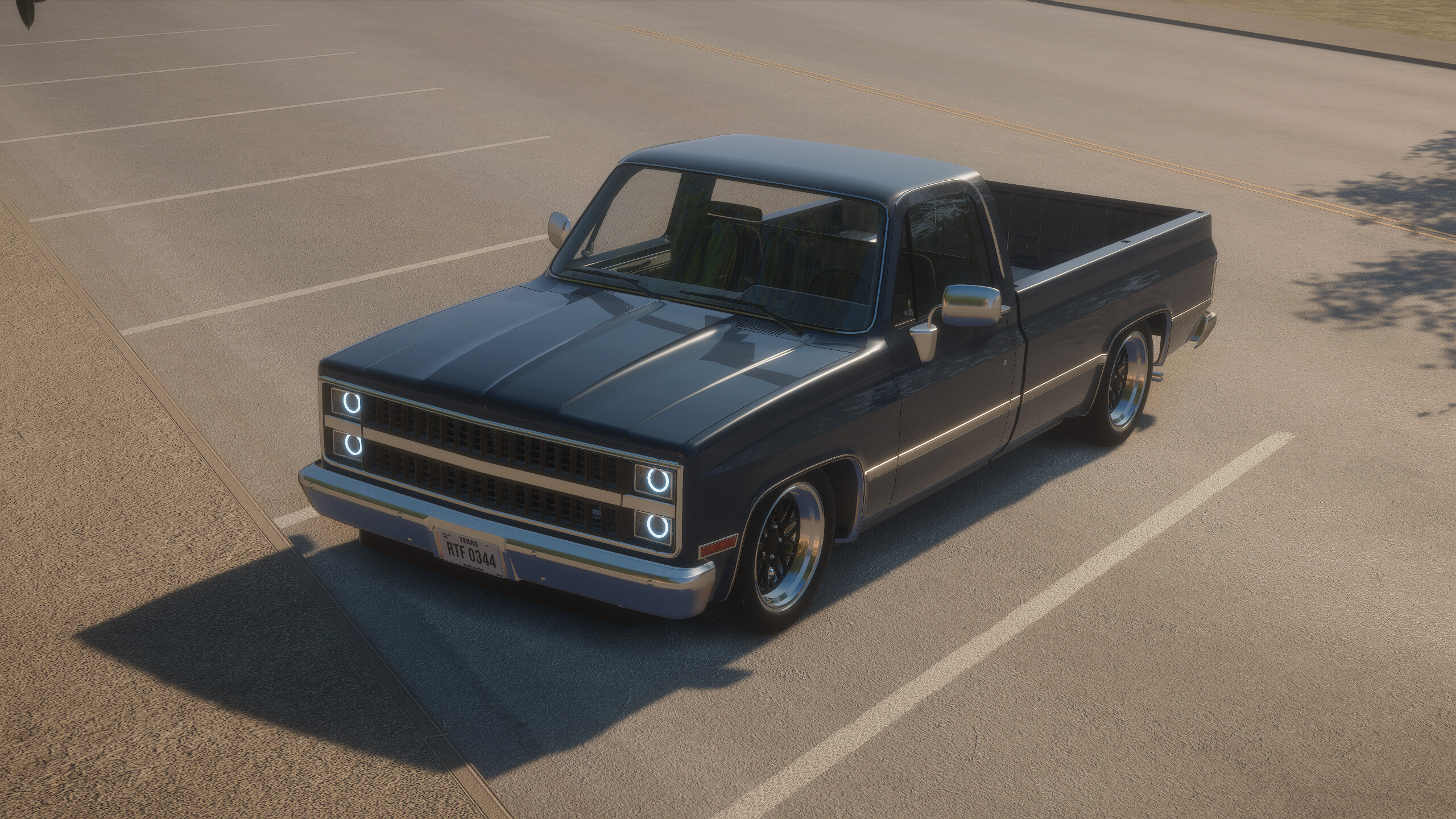 Black C10 pickup from Breakout Garage parked in a lot