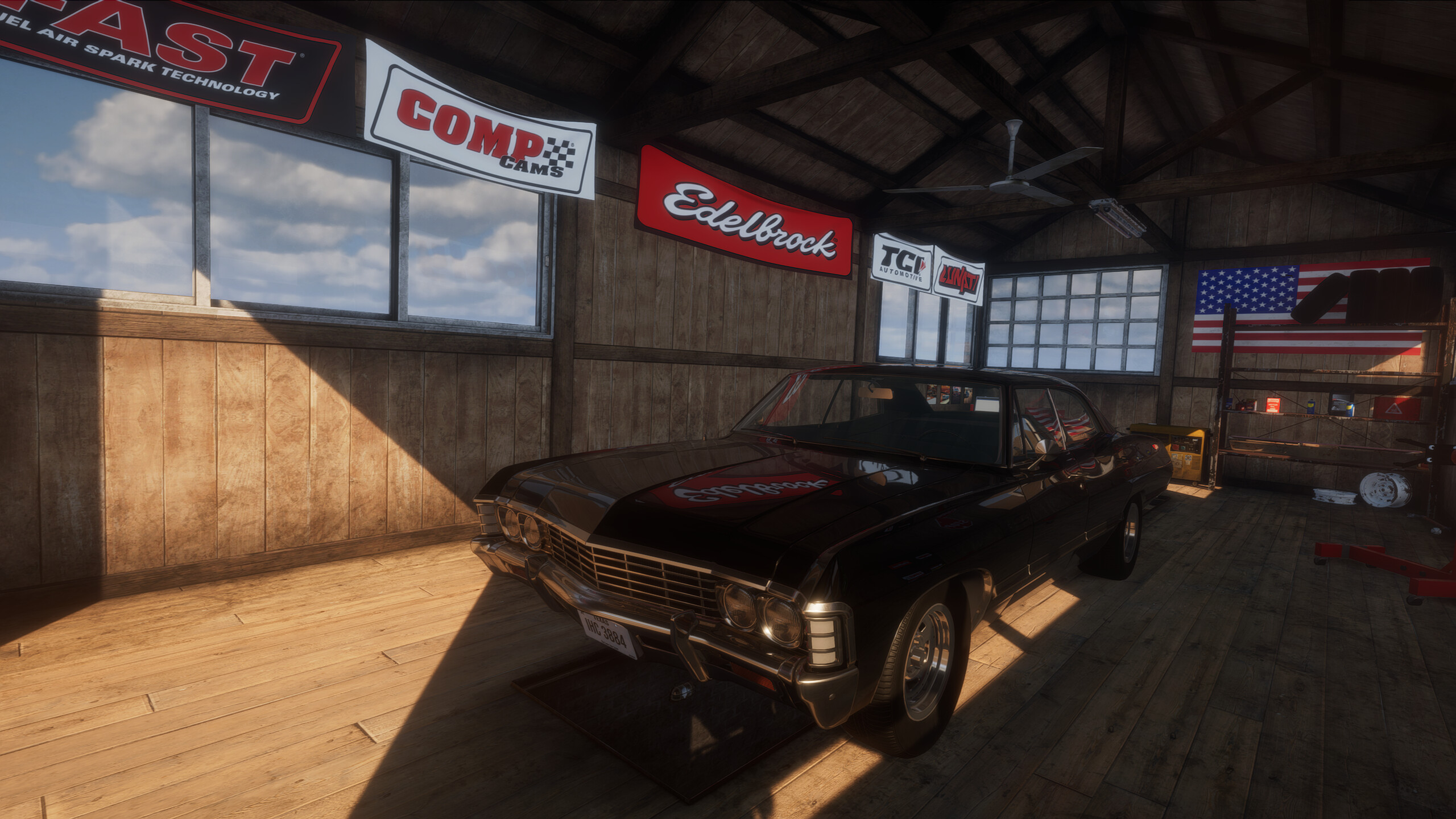 Black Impala project car parked in a Breakout Garage workshop