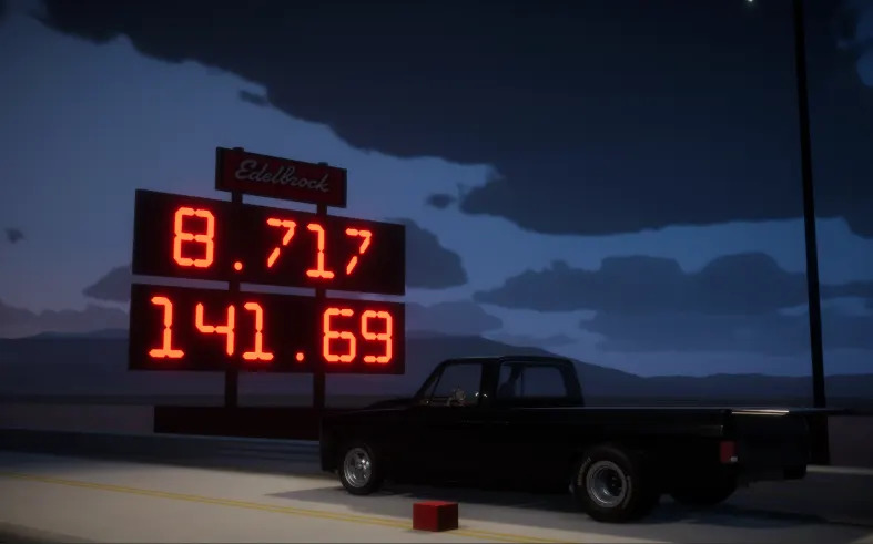 Breakout Garage pickup truck next to an 8.717-second drag time board at night